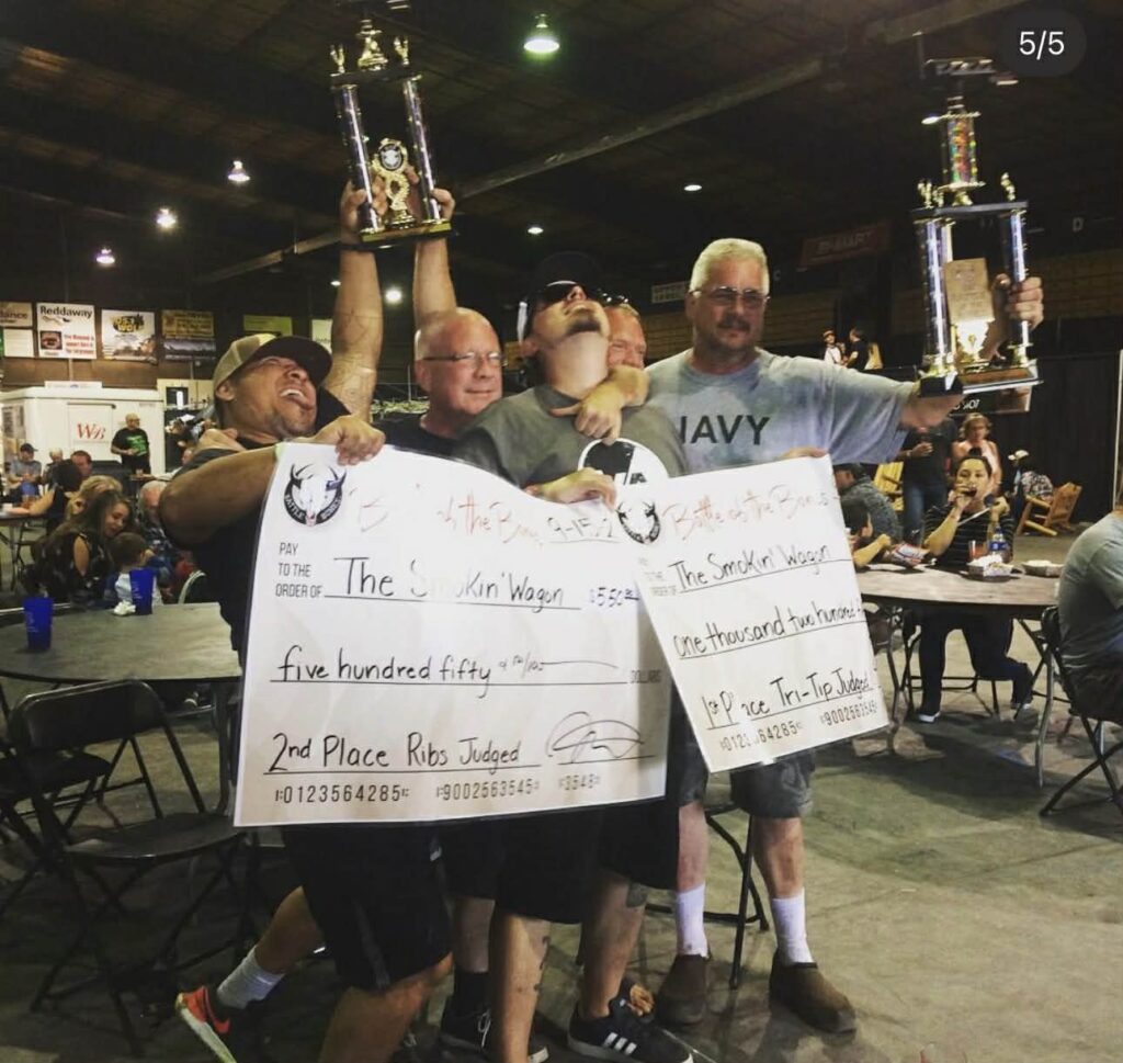 Pig-O-Latte’s team holding awards at local BBQ competition Oregon